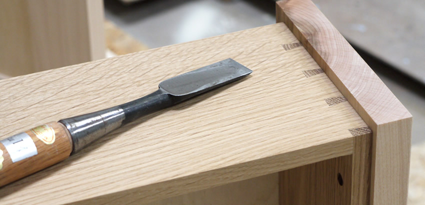 Small larder cupboard before painting. Solid maple carcass construction with birch ply panels and shelves. Oak dovetailed drawers and oak cornice.