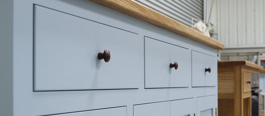 Freestanding sideboard with oak top and dovetailed drawer sides and hand turned walnut knobs. Hanpainted - Farrow & Ball, 'Lulworth Blue'.