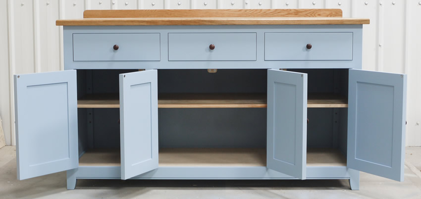 Freestanding sideboard with oak top and dovetsiled drawer sides and hand turned walnut knobs. Hanpainted - Farrow & Ball, 'Lulworth Blue'.