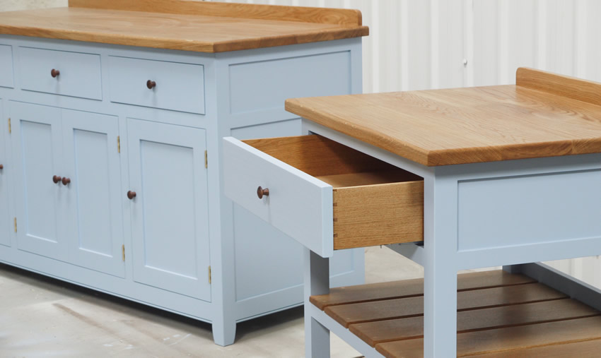 Freestanding slatted shelf unit with oak top and dovetasiled drawer sides and hand turned walnut knob. Hanpainted - Farrow & Ball, 'Lulworth Blue'.